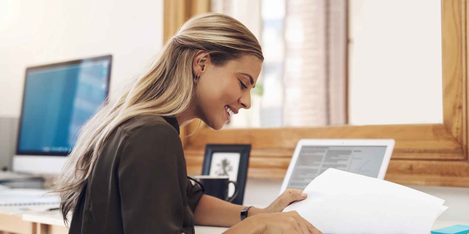 A team member welcoming a patient at the front desk