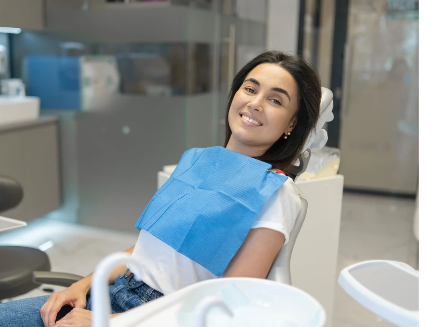 A smiling woman relaxing in the dental chair