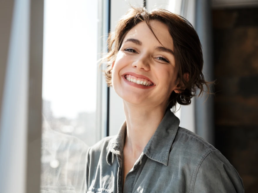A smiling woman with short brown hair
