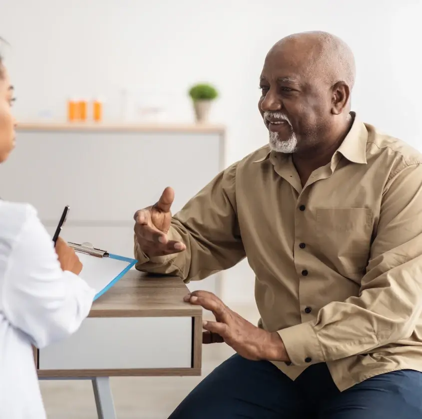 A senior man consulting with his dentist