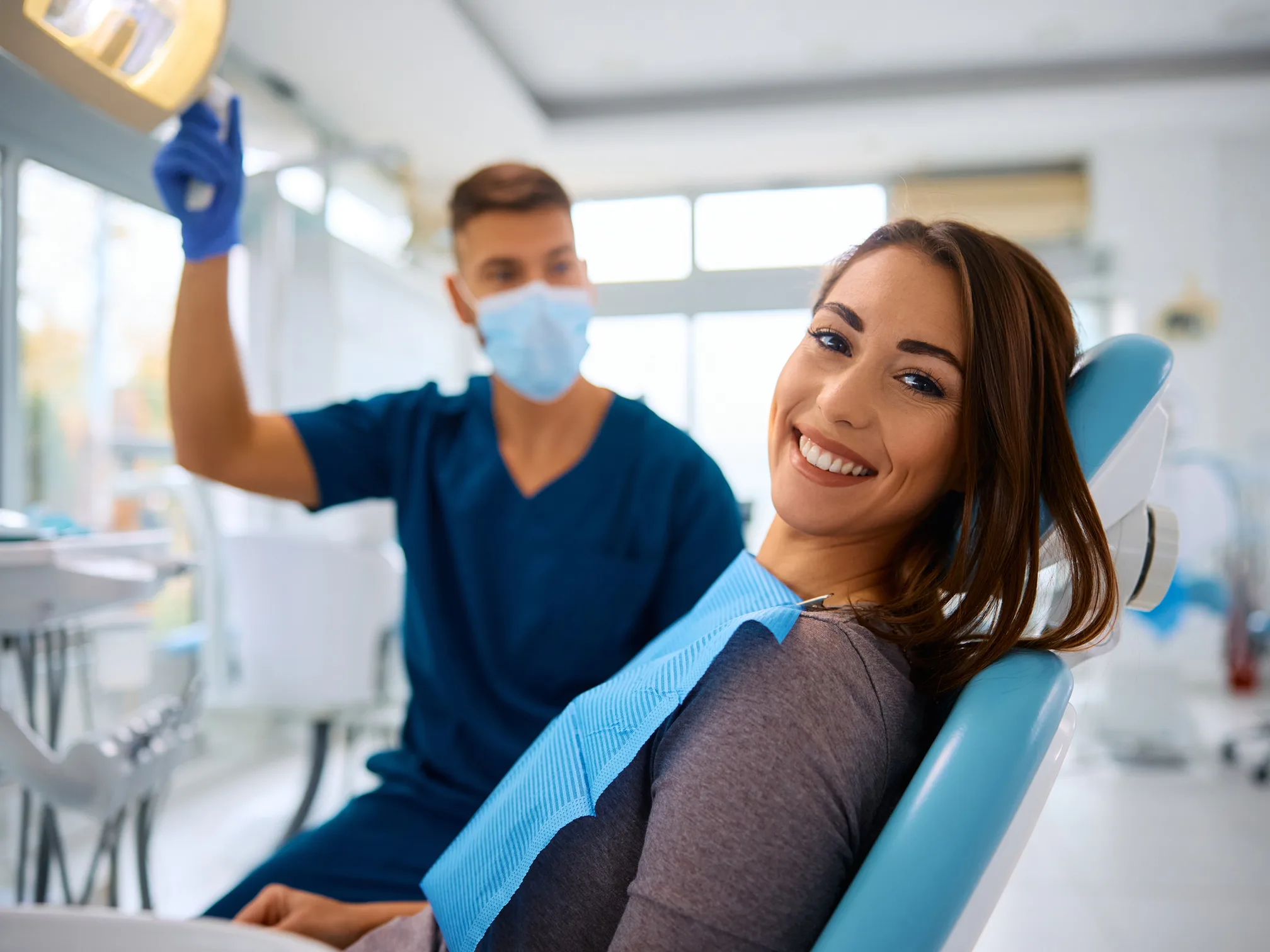 A hygienist performing a routine dental checkup